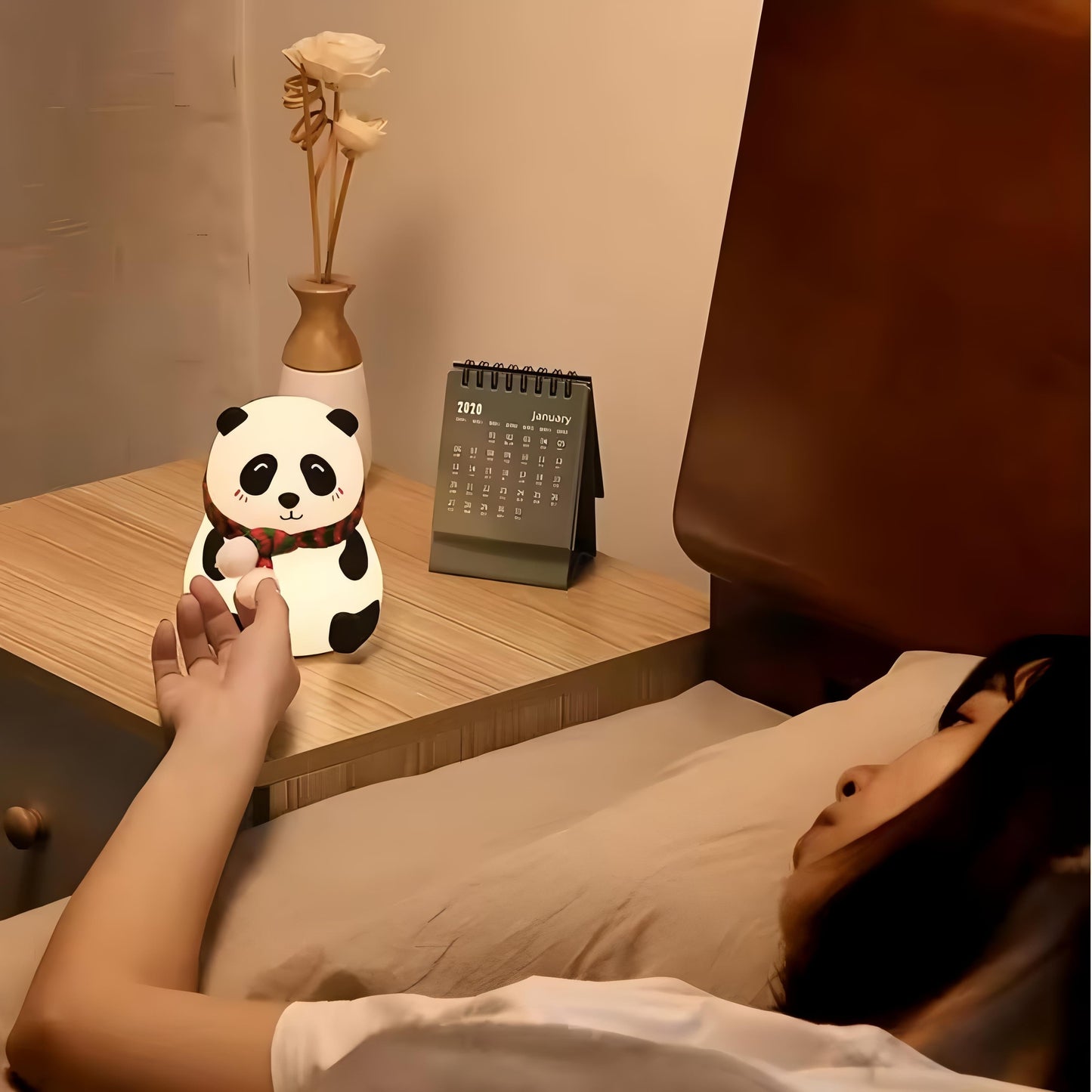 Panda night light on a wooden bedside table, adding a warm glow to your nighttime routine